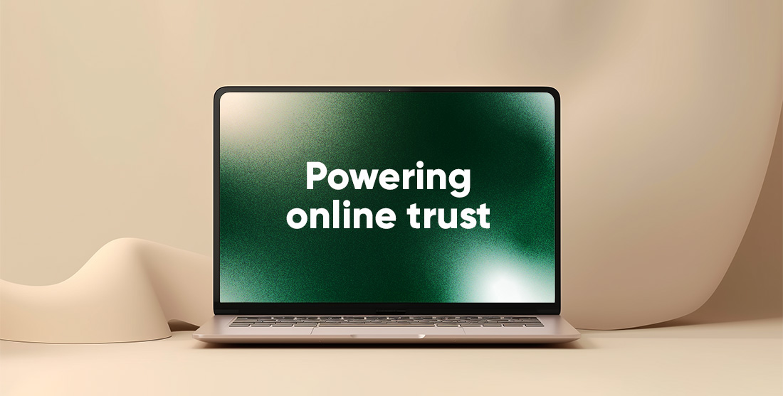 Green computer screen showing online trust on beige background